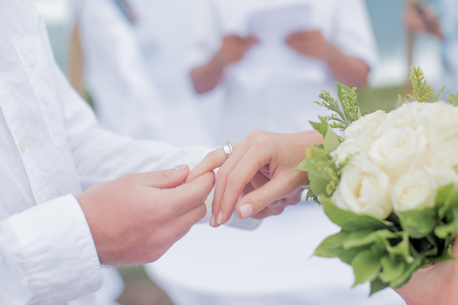 groom-wearing-ring-to-bride-during-wedding-ceremon-2022-11-14-05-04-05-utc.jpg